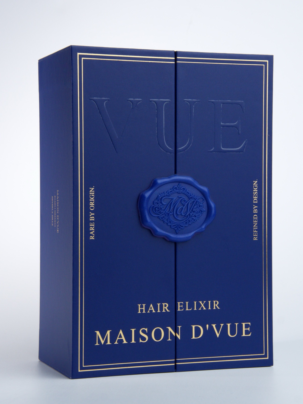 The MAISON D'VUE coffret, closed and hand-sealed with the cobalt wax monogram